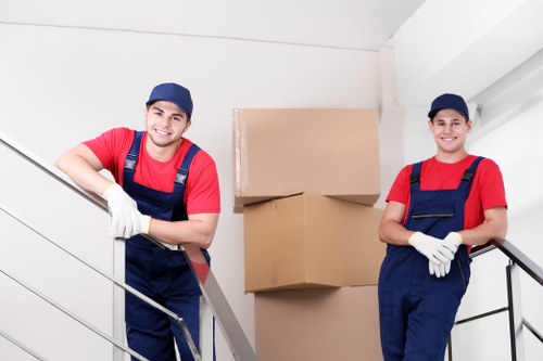 Professional movers handling a compact flat relocation
