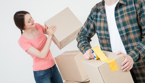 Packed moving boxes and protective wrapping prepared for a flat move in North Kensington