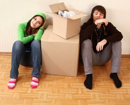 Carefully organised flat relocation in North Kensington with labelled boxes and furniture