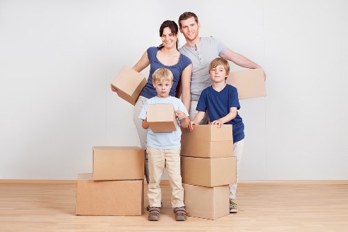 Customer following safe manual handling practices with boxed items