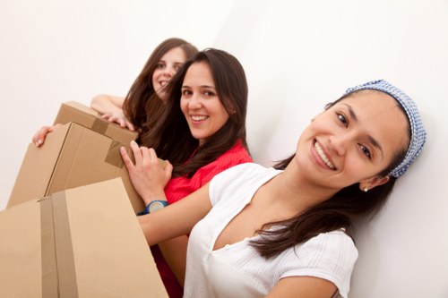 Moving day support for local removals in Northkensington with packed boxes and a removal van
